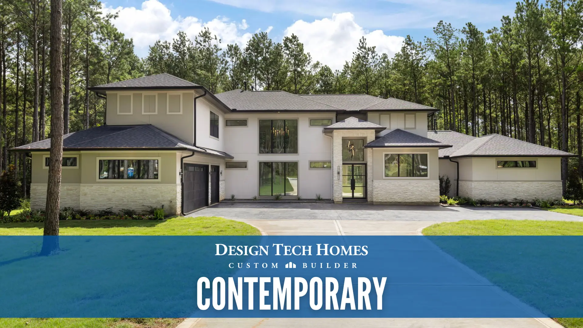 Contemporary two-story custom home with light stucco exterior, large glass windows, multiple rooflines, and driveway surrounded by tall pine trees