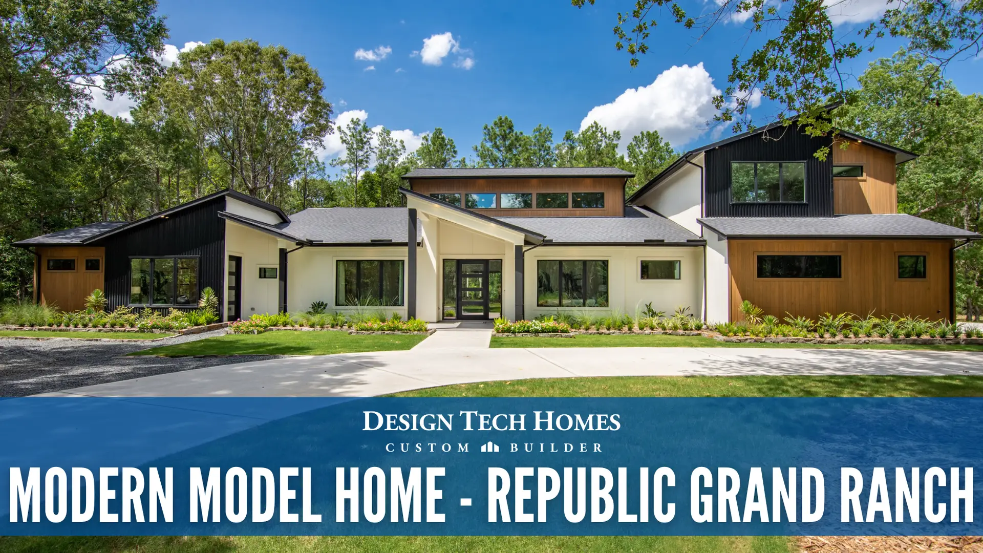 Modern custom home exterior with mixed wood and stucco siding, large windows, and covered entry surrounded by tall pine trees