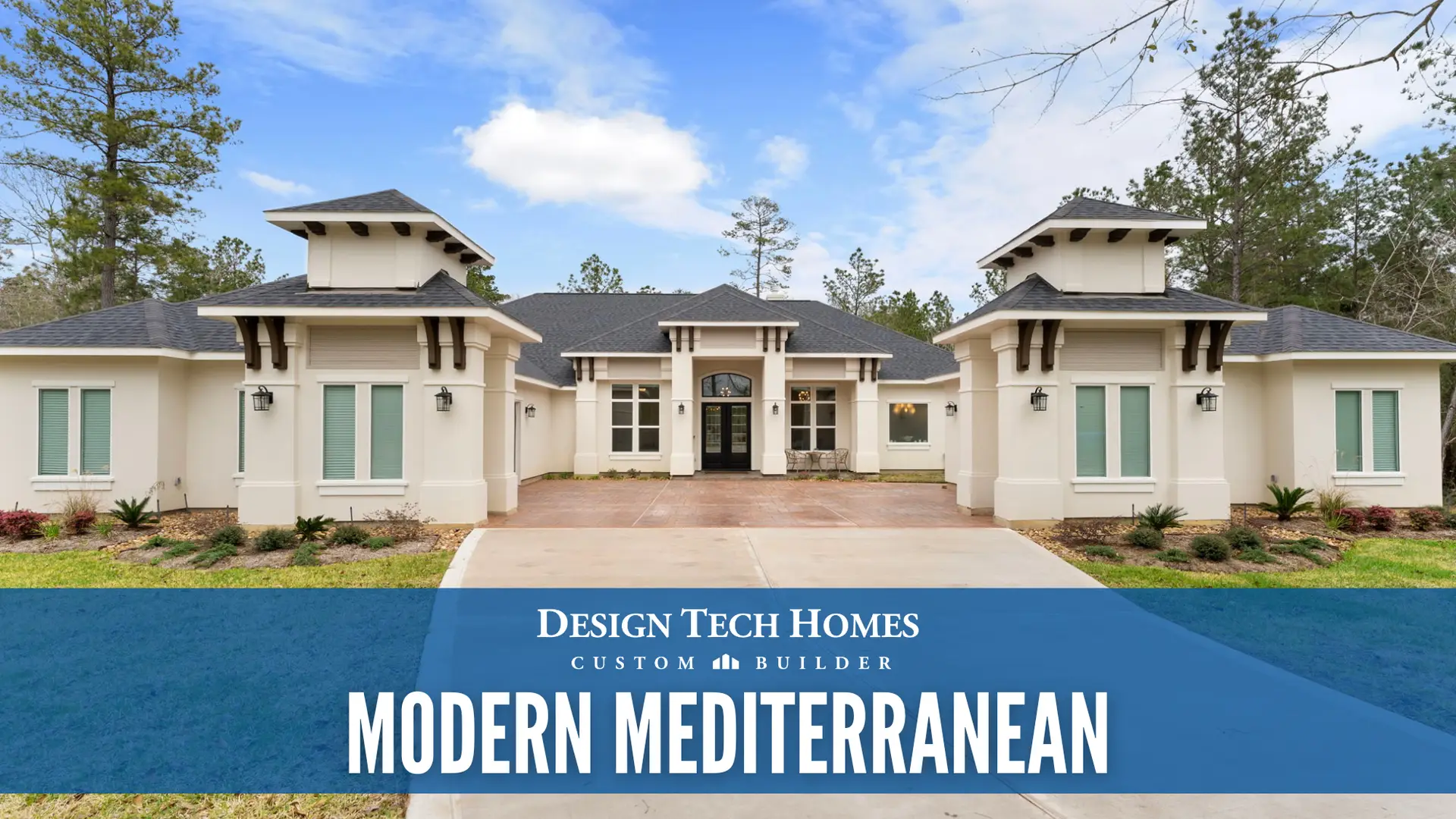 Modern Mediterranean custom home with light stucco exterior, tile roof, arched entryway, tall columns, and large windows surrounded by pine trees