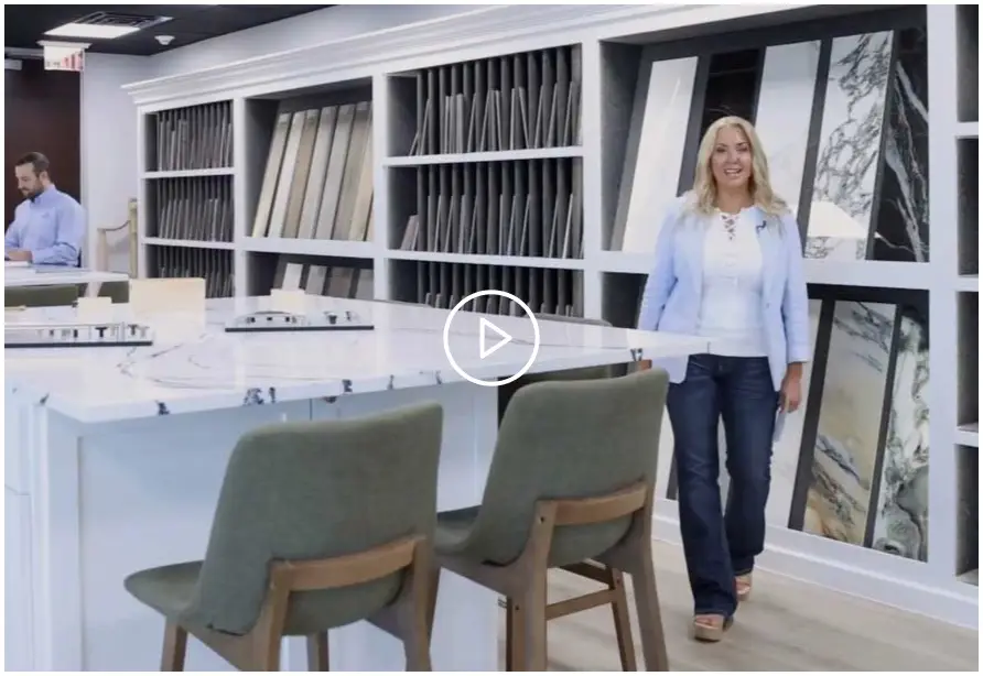 Design consultant in a custom home design studio showcasing material selections and finishes for a luxury home project.