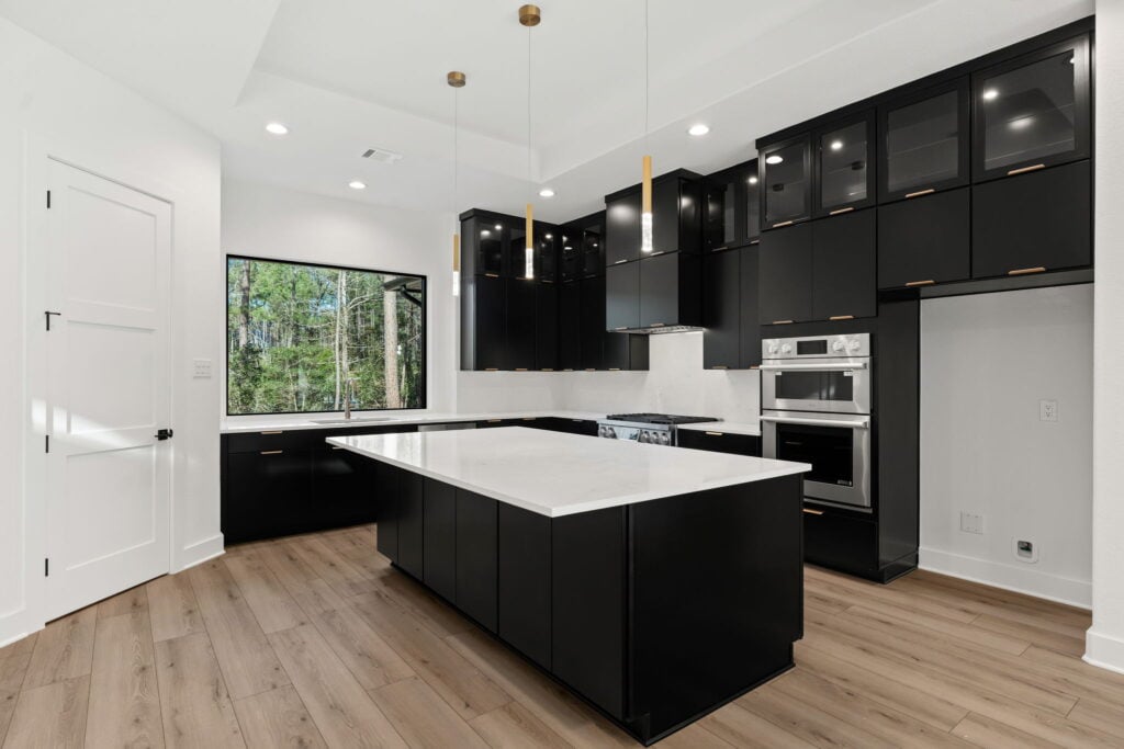 Modern kitchen with black cabinets and large island